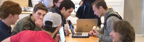 Faculty and Students at Table at Digital Showcase