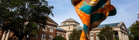 Wind sculpture in the foreground with Chambers in the background