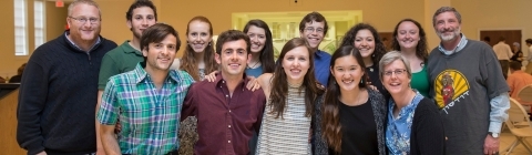 Jewish students and chaplains smile at the camera