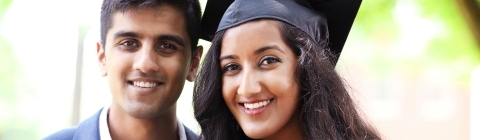 Student poses with family member for portrait