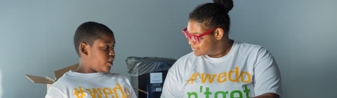 Davidson student and Freedom School student chat while grabbing snacks