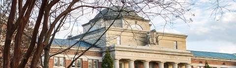 Students hanging out on Chambers Lawn, socializing, in hammocks, and playing outdoor sports