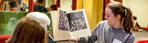 Bonner Scholar reads book to elementary children