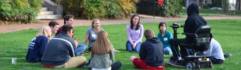 Chidsey Fellows gather in a circle on Chambers lawn