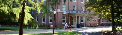 Little Dorm exterior with students walking by