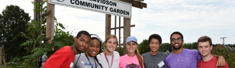 Volunteering at Community Garden students pose for picture