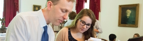 Graham Bullock and student analyze a chart