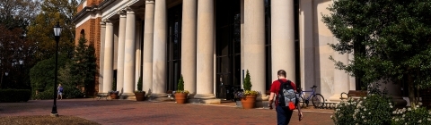 E.H.Little Library Exterior with student walking in