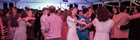 Fall Fling students and alumni dance in outdoor tent
