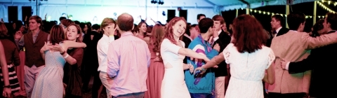 Fall Fling students and alumni dance in outdoor tent