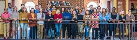 Belk Scholars pose on a balcony