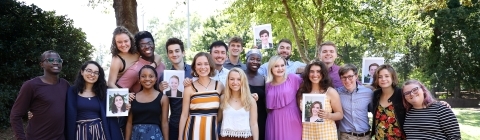 Belk students gather holding photos of missing Belks