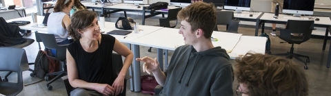 Professor speaking to students about their presentations