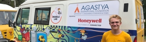 Evan Goosmann next to Honeywell Mobile Lab