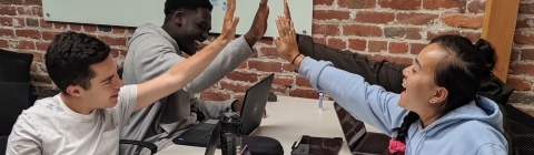 students in class high fiving
