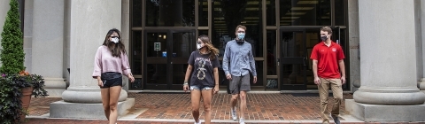 Students in Masks in Front of Library