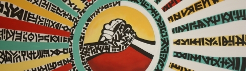 Mural of two hands together and red, yellow and green colors