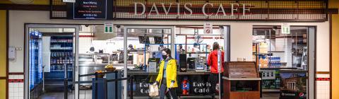 Davis Café Exterior within Davidson College's College Union and Students with Take-Away Food