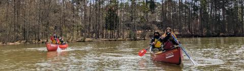 Students Canoeing on Lake Norman Wearing Masks