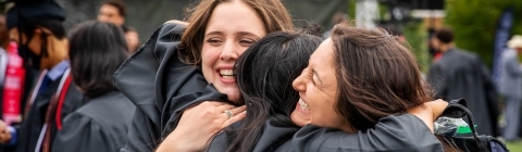 Students Hugging at Commencement 