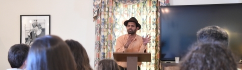 Professor Zamir at podium speaking to students