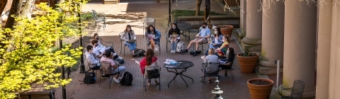 Outdoor Class Group Meeting in a Circle in Courtyard