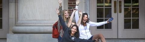 Students with Arms in the Air Celebrating on Chambers Steps