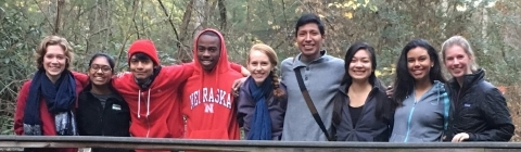 students at Dharma Retreat huddled together and smiling