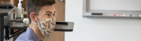 Student in Class Using Laptop and Wearing Mask