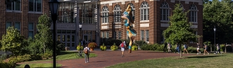 Students heading to class in front of the Wall Building