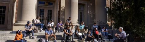Students gather for an outdoor class on the steps of chambers