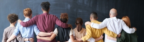 group of people with their arms around each other