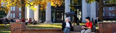professor and student conversing