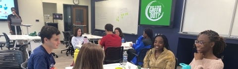 students sitting at table during Green Dot Training