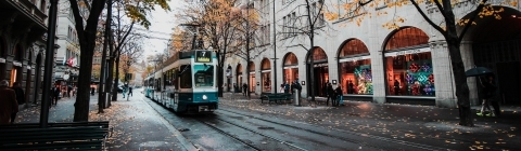 Stock photo of city with train and foliage