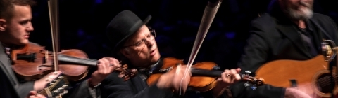 appalachian ensemble of three men playing string instruments