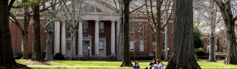 Students studying outside Baker-Watt Complex