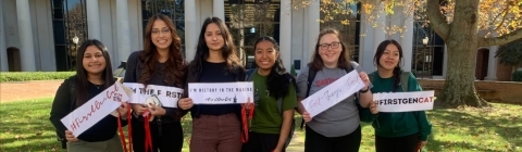 Students Holding First Gen Signs