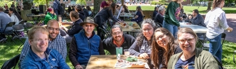 Faculty and Staff at Outdoor Table during Verna Miller Case Symposium