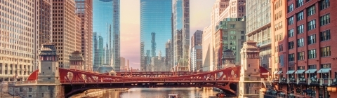 Chicago buildings with river boat in foreground