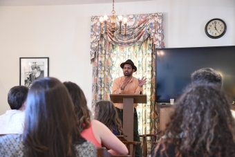 Students heads face Prof. Zamir as he stands at a podium and speaking