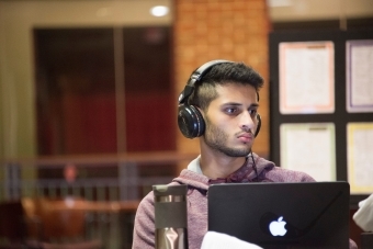 Student studies with his laptops