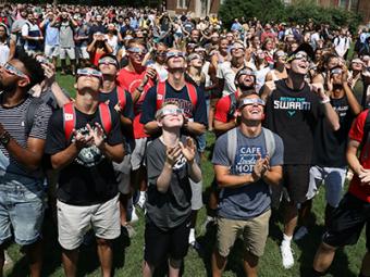 Students on the front lawn during the eclipse