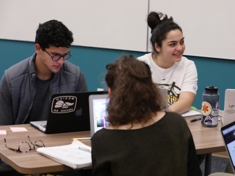 Students work on project on laptops