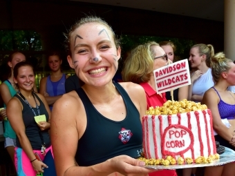 Cake race winner holds a cake