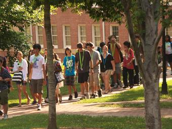 Group of young students on campus for camp walk together