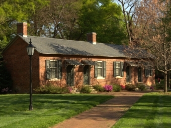 Exterior of Elm Row with visible flower bushes