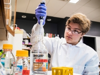 Student in lab with science equipment