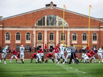 Football Game at Richardson Stadium with players and ref on the field