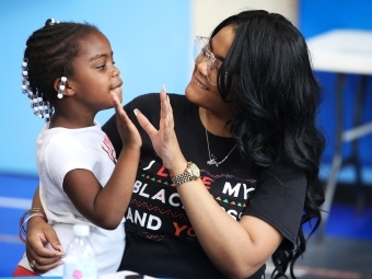 Student mentor at Freedom Schools interacts with younger student